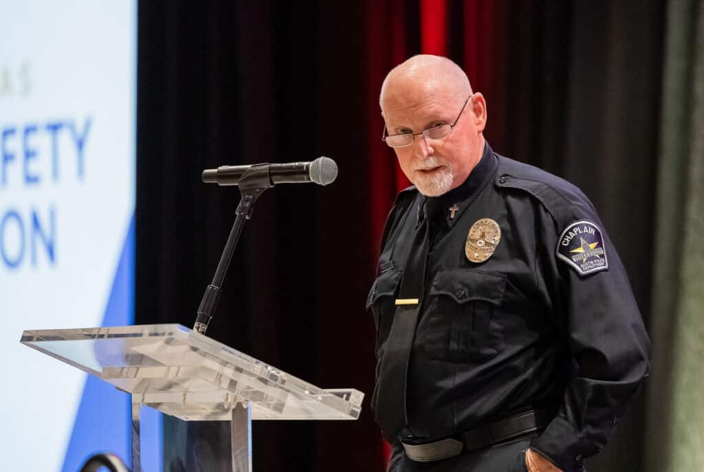 Chaplain speaking at podium during event