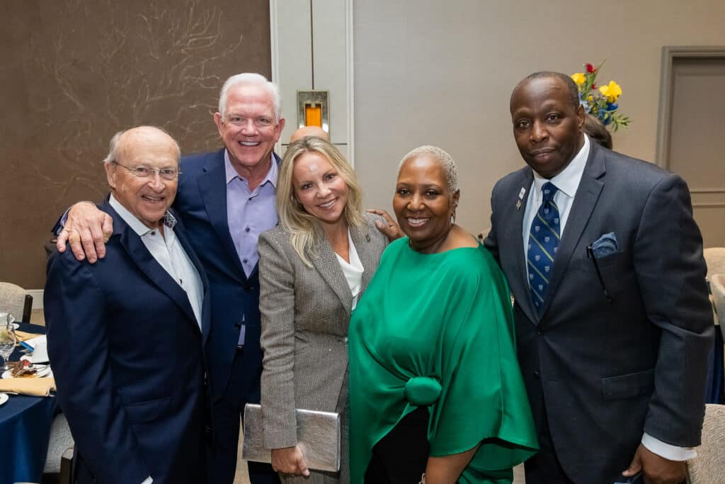 Group of people smiling at an event
