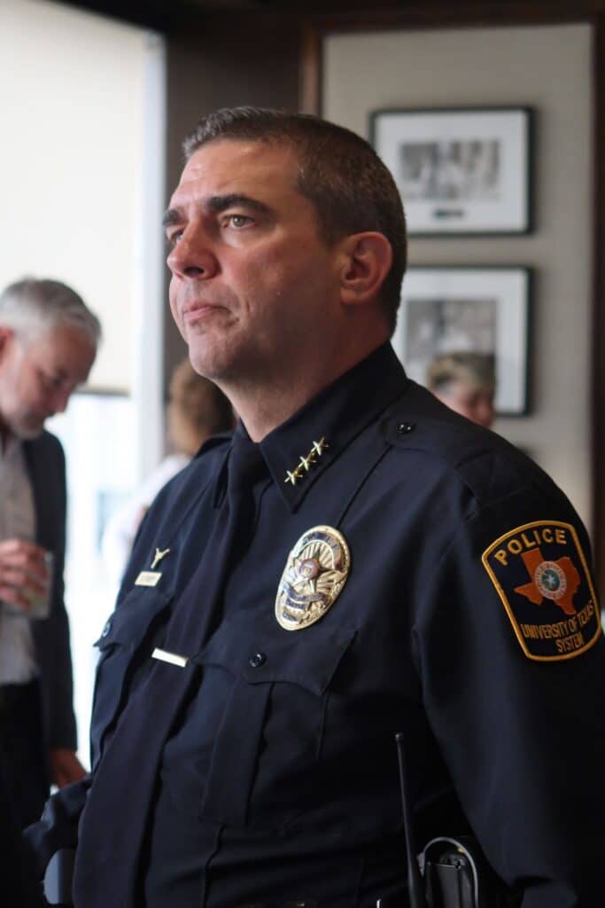 Police chief in uniform at indoor event