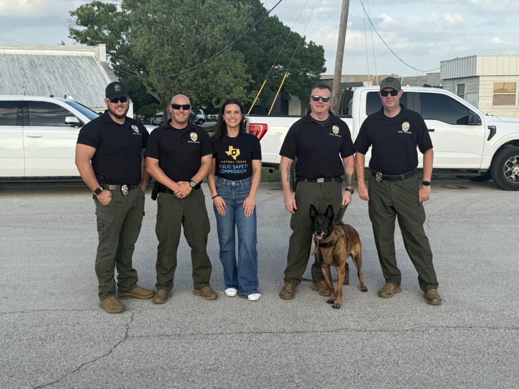 Public safety officers with K9 in parking lot